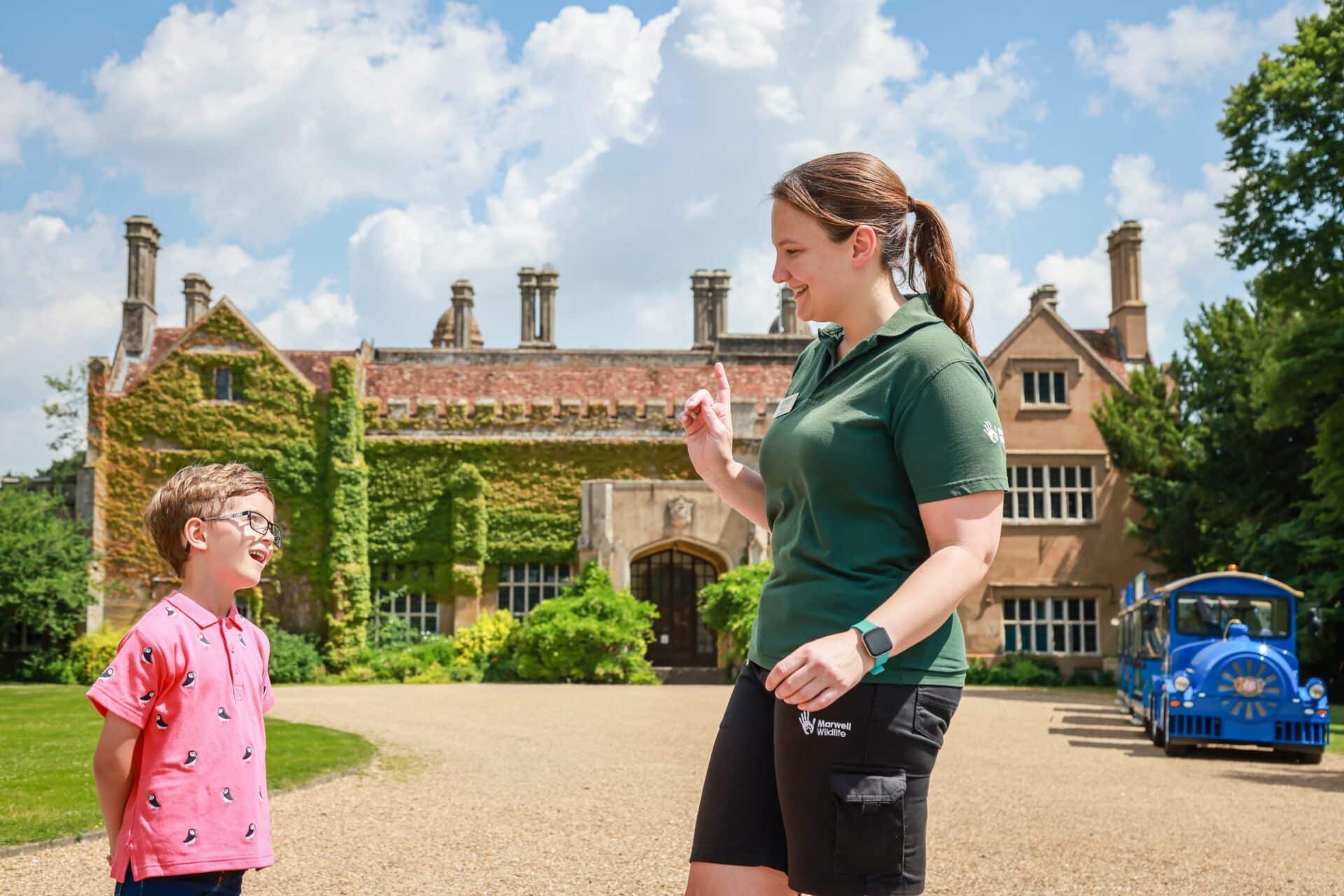 Boy and staff member outside Marwell Hall