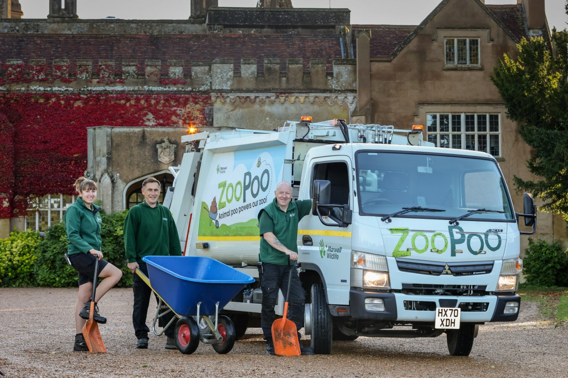 Marwell staff pose with refuse truck with zoo poo decals