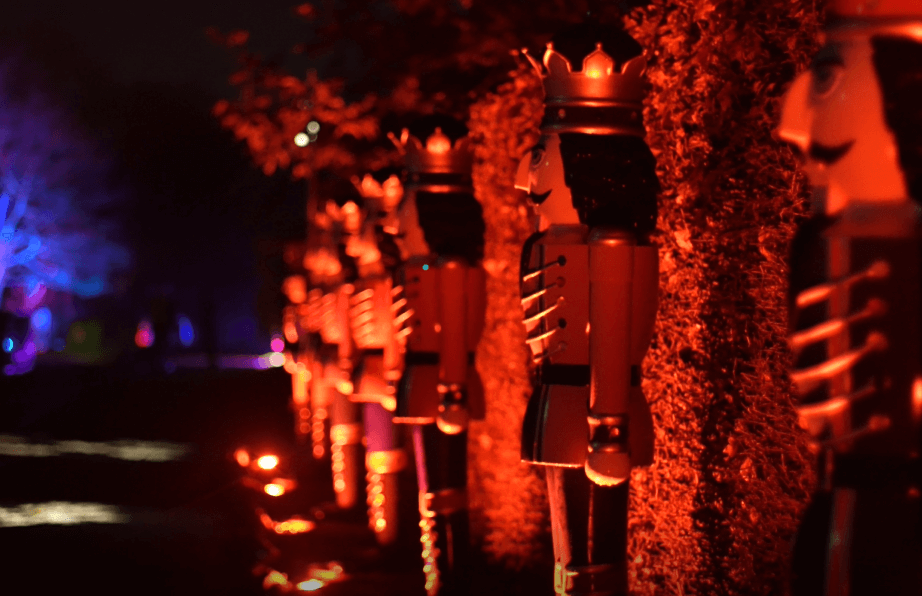 Giant nutcrackers are lit up in a row at Glow Marwell