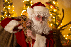 Father Christmas carrying his gift sack at Glow Marwell
