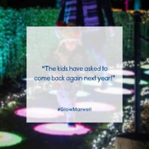 A young child hops along colourful light-up stepping stones. Text in the middle reads "The kids have asked to come back again next year!" #Glow Marwell