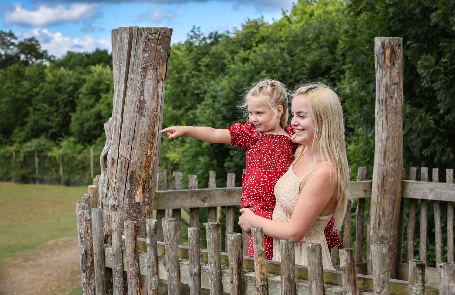 A mother and child look out over the Wild Explorers habitat at Marwell Zoo