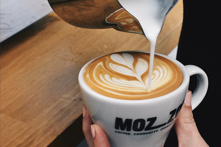 A barista pouring Mozzo coffee