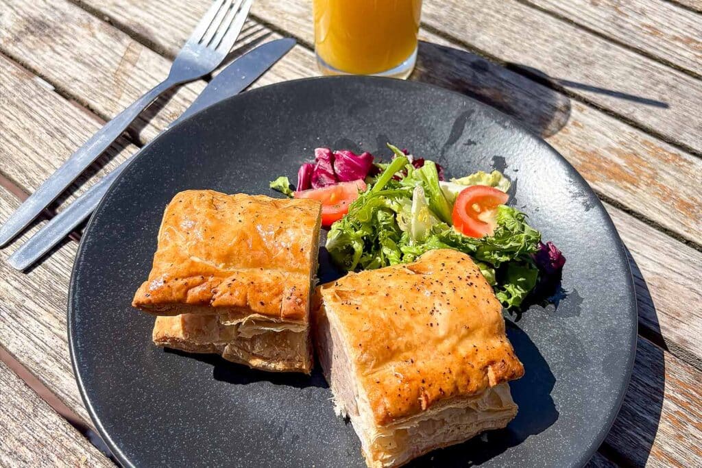 A sausage roll, salad and orange juice at Marwell Zoo