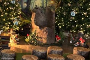 A woodland grotto experience at Marwell Hall, with logs where children can settle down for storytelling