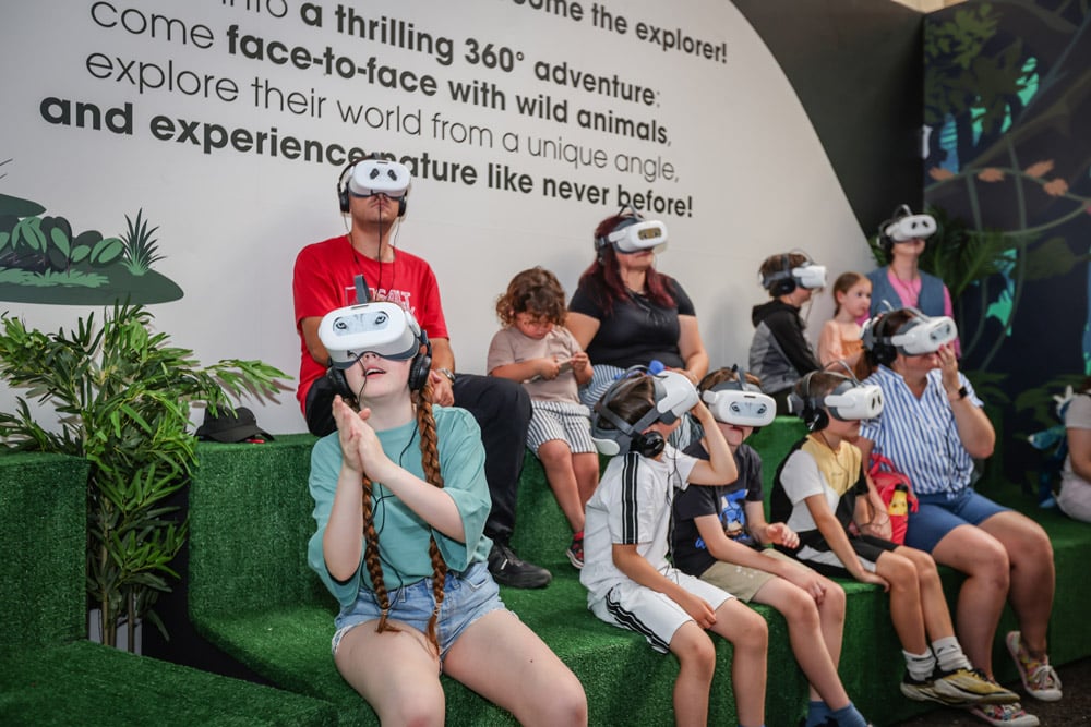 A group of people with VR headsets on at Marwell Zoo's Virtual Reality Experience