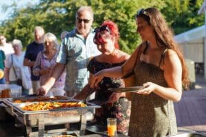 Guests enjoy a buffet dinner during a Summer Evening at Marwell Zoo