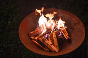 Fire burning in a circular metal firepit